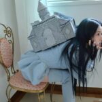 Chaeyoung of TWICE posing in a photoshoot for her solo album LIL FANTASY vol.1, highlighting her first solo project with artistic styling, expressive pose, and visual concept for SHOOT (Firecracker), released September 12, 2025.