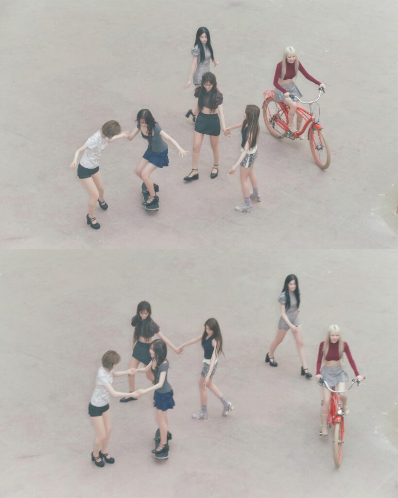 NMIXX ‘Blue Valentine Teaser Photos — Members Riding Bicycles Skateboards October 2025 Comeback NMIXX teaser image for Blue Valentine album — six members riding bicycles and skateboards outdoors, smiling brightly, part of the “Valentine version” concept photos released September 27, 2025.