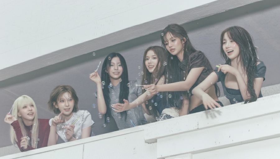 NMIXX ‘Blue Valentine Teaser — Member Blowing Bubbles October Comeback 2025 NMIXX Blue Valentine teaser image — member blowing bubbles, part of 31 concept photos for first full-length album release October 13, 2025.